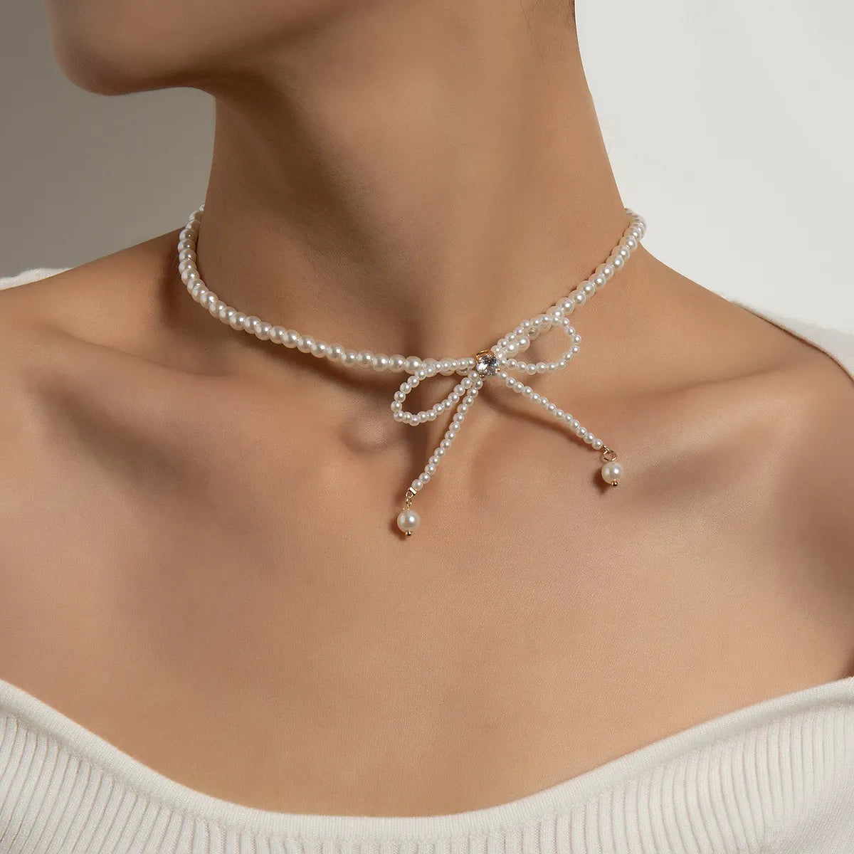 Elegant diamond necklaces for women -Simple Style Commute Bow Knot Artificial Pearl Beaded Women's Necklace