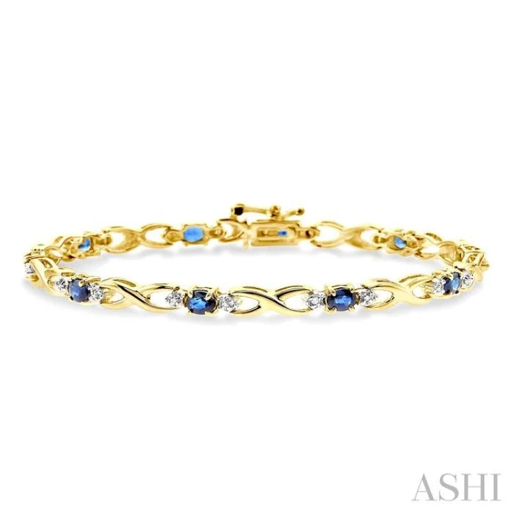 Personalized bangles for women -4x3 MM Oval Cut Sapphire and 1/10 Ctw Single Cut Diamond Bracelet in 14K Yellow Gold