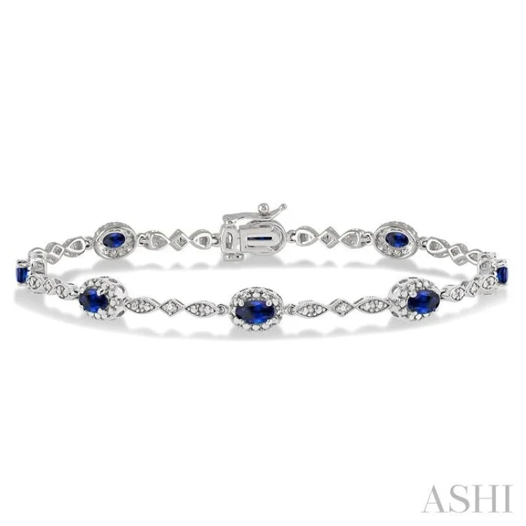 Silver bracelets for women -5x3 MM Oval Cut Sapphire and 1/20 Ctw Single Cut Diamond Bracelet in 14K White Gold